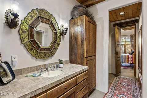 a bedroom with bed and wooden floor