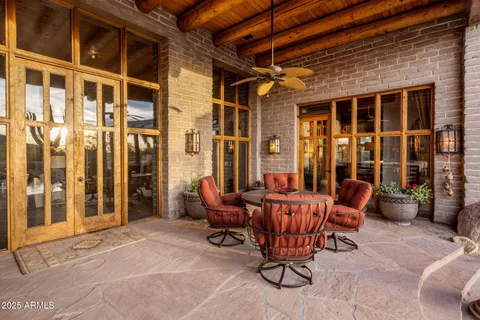 a view of a patio with dining table and chairs with a couches near a patio