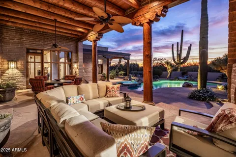 a outdoor dining space with furniture and city view