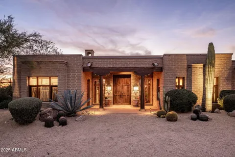 a view of a house with basketball court