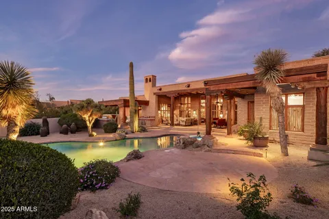 a building outdoor space with patio furniture and outdoor seating