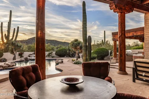 a view of balcony with couches table and chairs