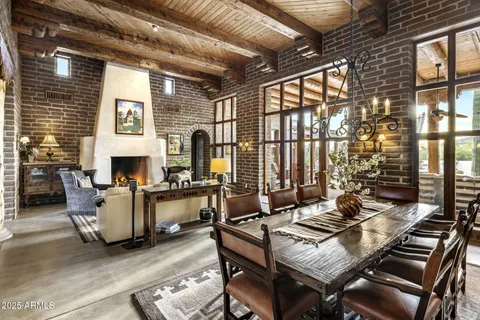 a living room with furniture large window and outer view