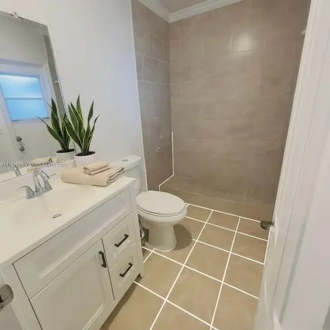 a bathroom with a toilet a sink and a mirror