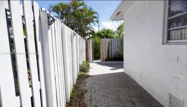a view of entryway with wooden floor and front door