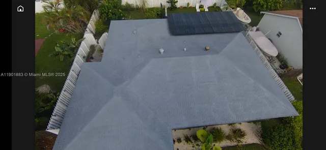 an aerial view of residential house with outdoor space