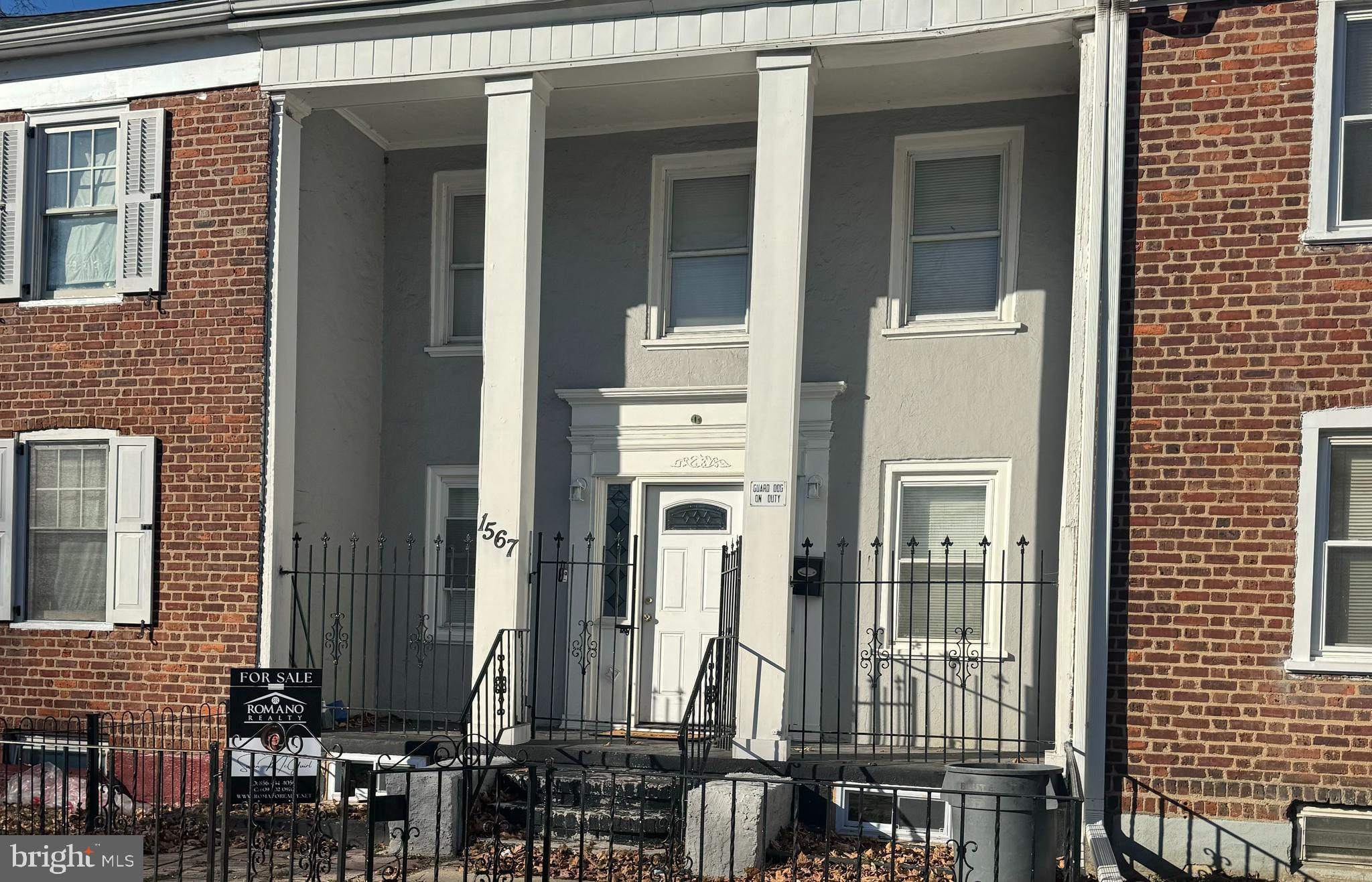 1567 Collings Road Camden, NJ 08104 - Photo 1 of 16 a view of a brick house with many windows