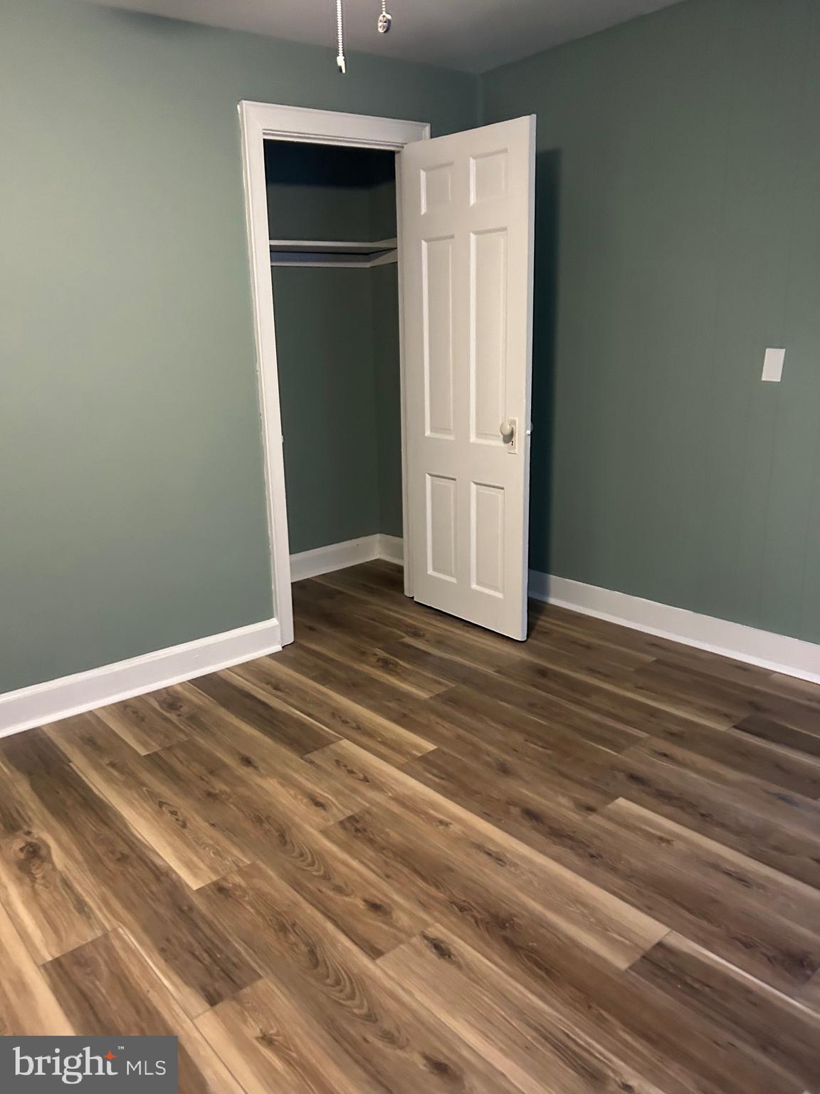 1567 Collings Road Camden, NJ 08104 - Photo 15 of 16 a view of a livingroom with wooden floor