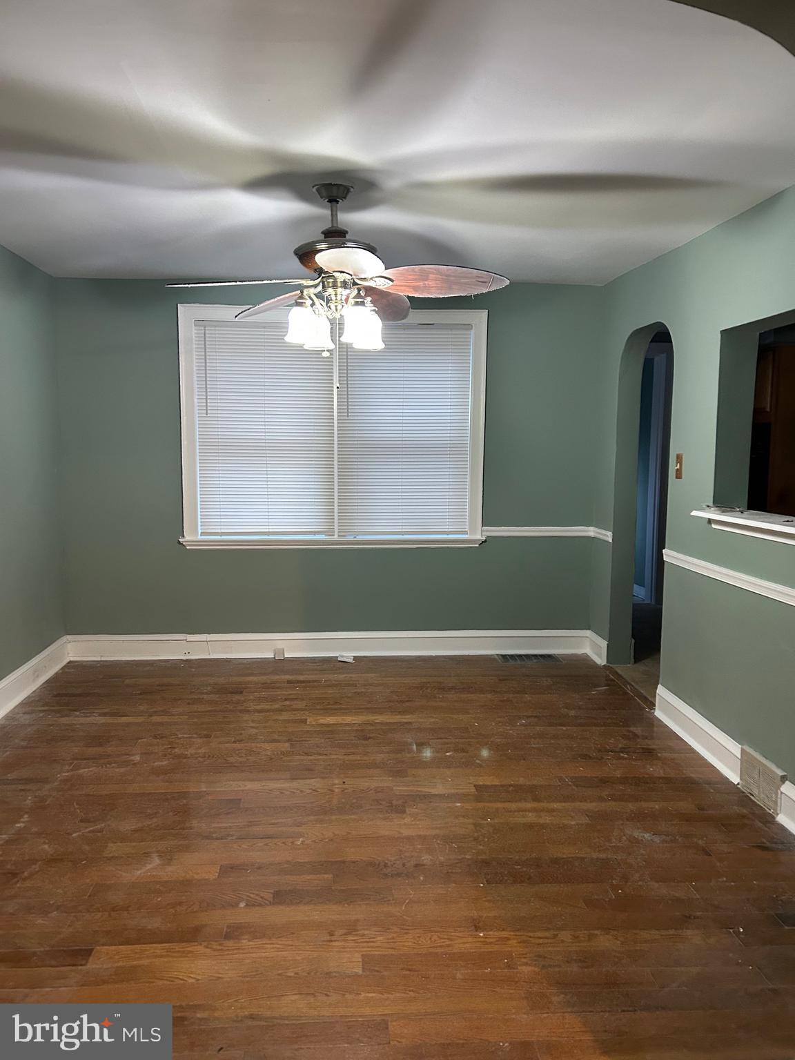 1567 Collings Road Camden, NJ 08104 - Photo 5 of 16 a view of a room window and wooden floor
