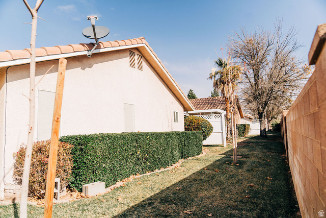 1825 West Mathis Park Place, Unit 40 St. George, UT 84770 - Photo 6 of 28 View of home's exterior with a tiled roof and stucco siding