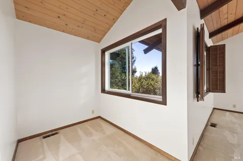 a view of a room that has a window in it