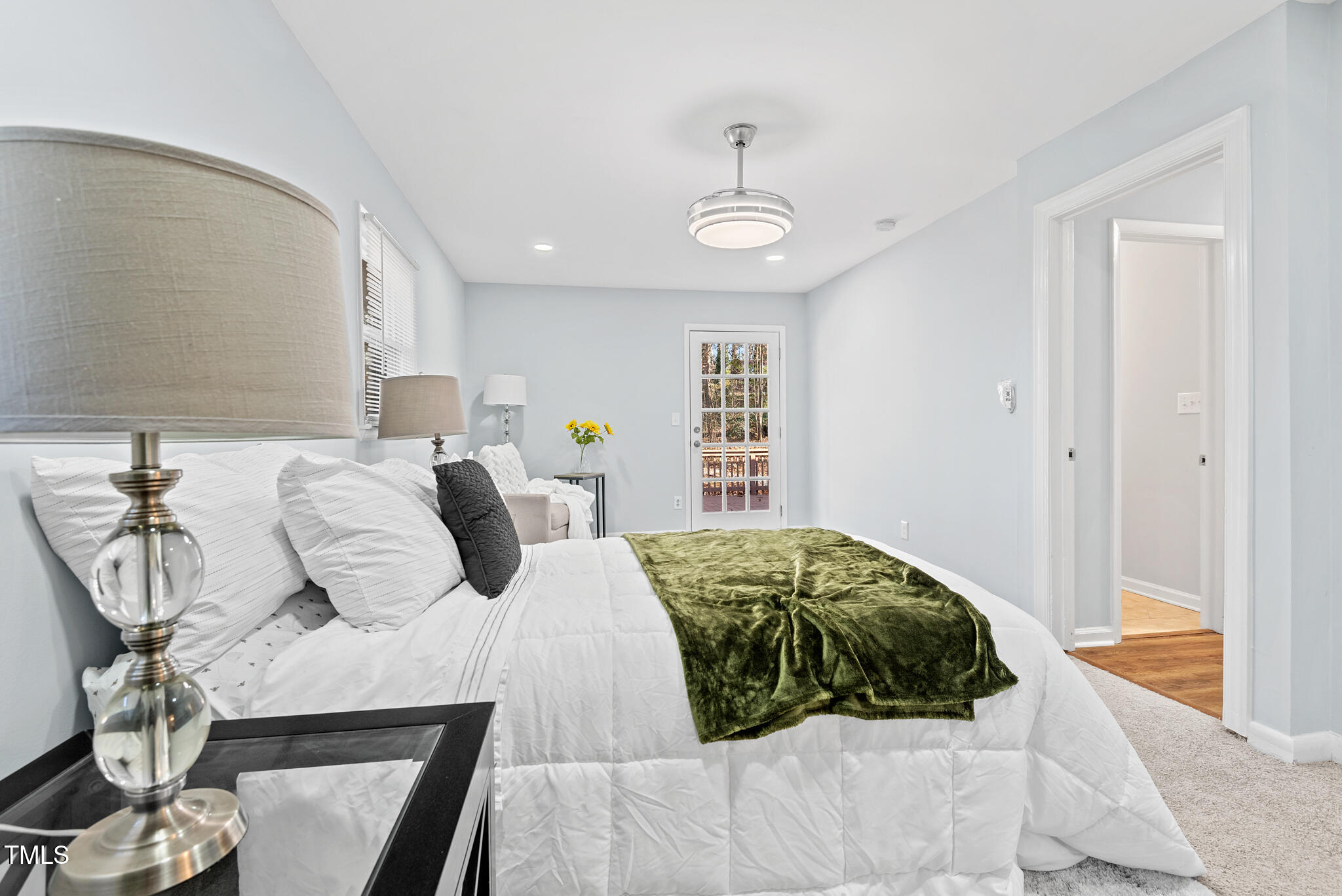 6512 Johnsdale Road Raleigh, NC 27615 - Photo 19 of 34 a bedroom with a large bed and a window