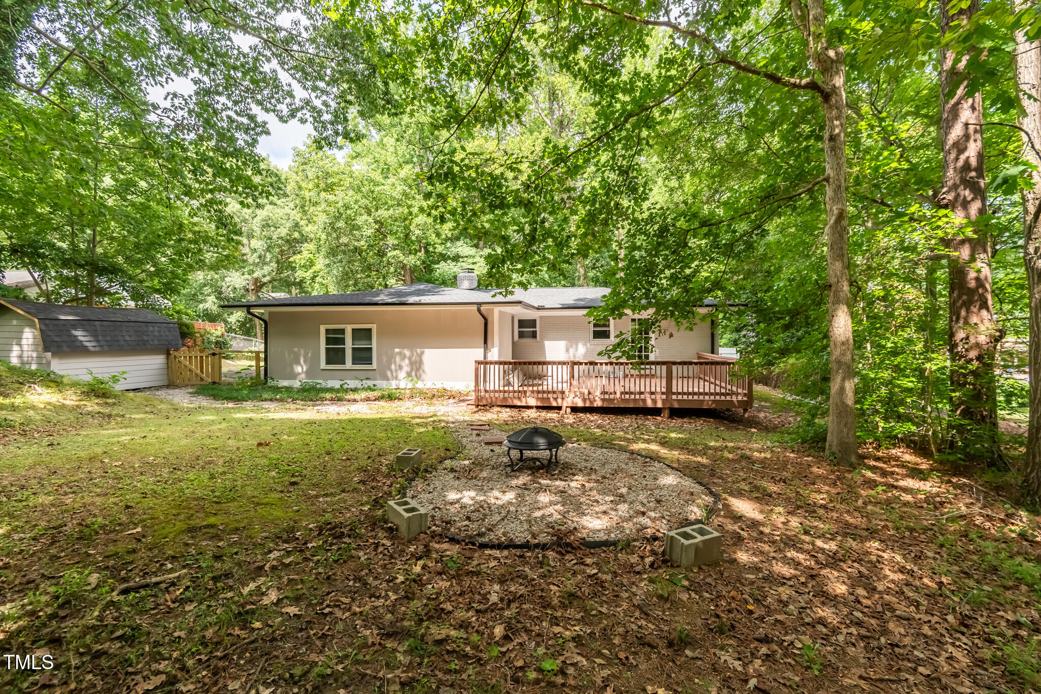 6512 Johnsdale Road Raleigh, NC 27615 - Photo 33 of 34 a view of a house with backyard and a tree
