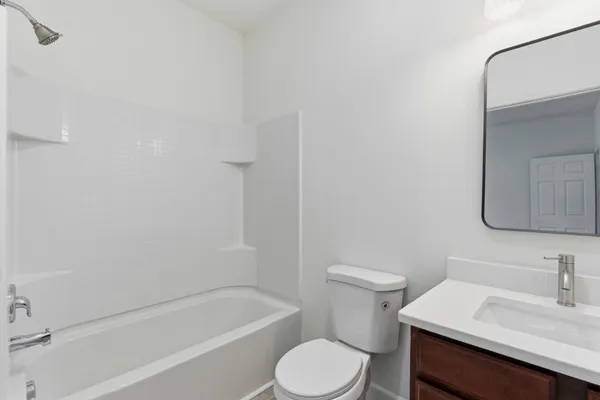 a bathroom with a sink toilet and bathtub