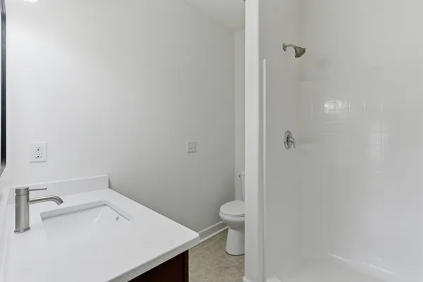 a bathroom with a sink and toilet