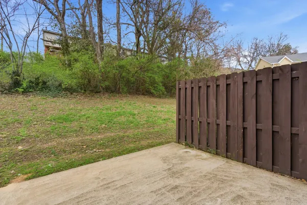 a view of a backyard of the house