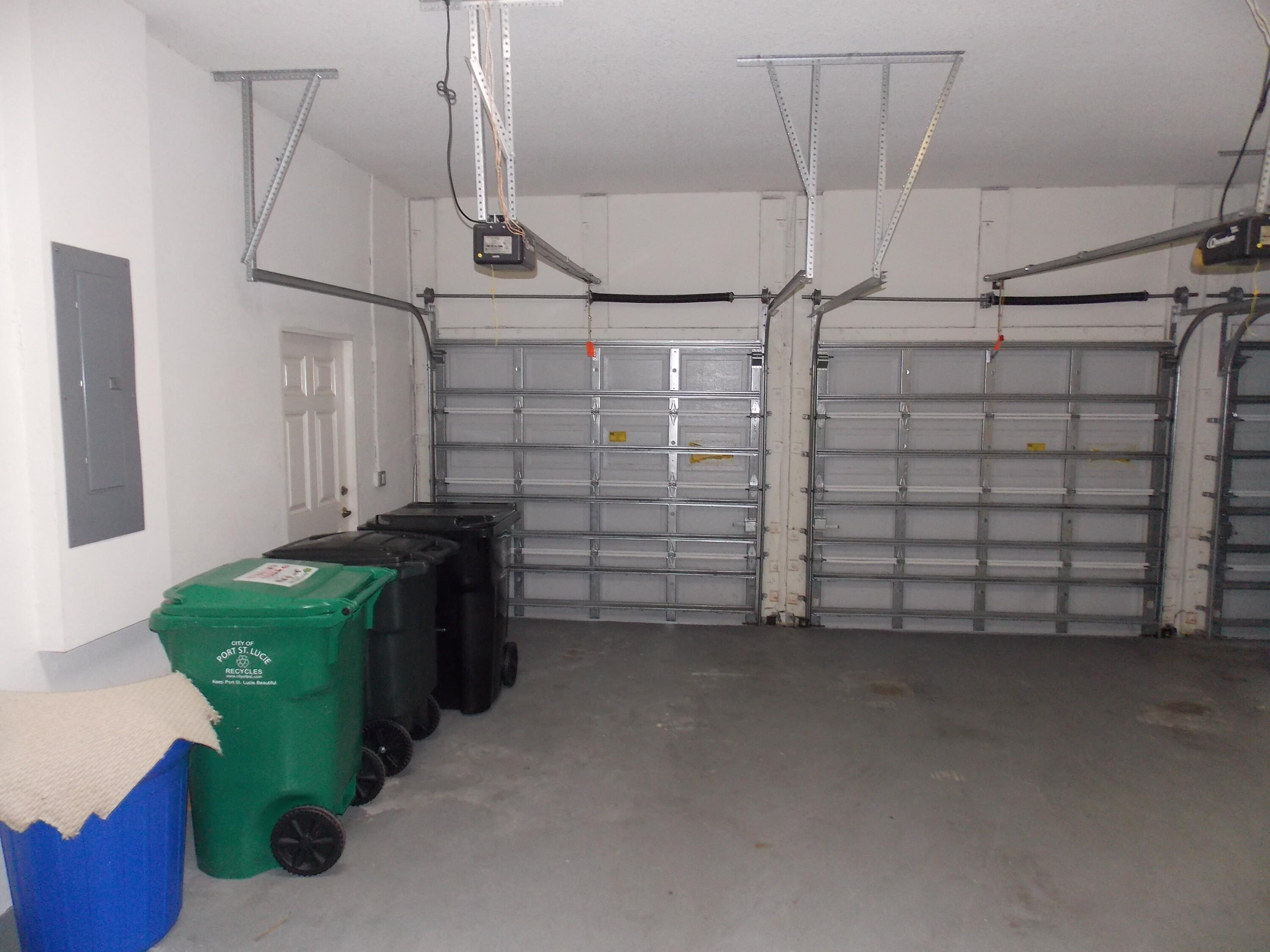 323 Northwest Sheffield Circle Port St. Lucie, FL 34983 - Photo 13 of 31 a view of a garage