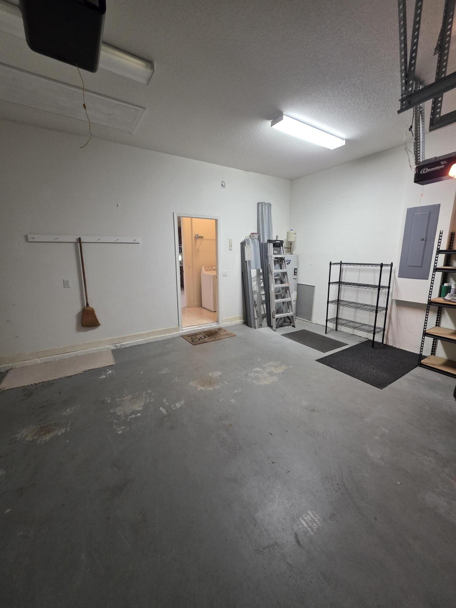 323 Northwest Sheffield Circle Port St. Lucie, FL 34983 - Photo 14 of 31 a view of a livingroom with furniture and a ceiling fan