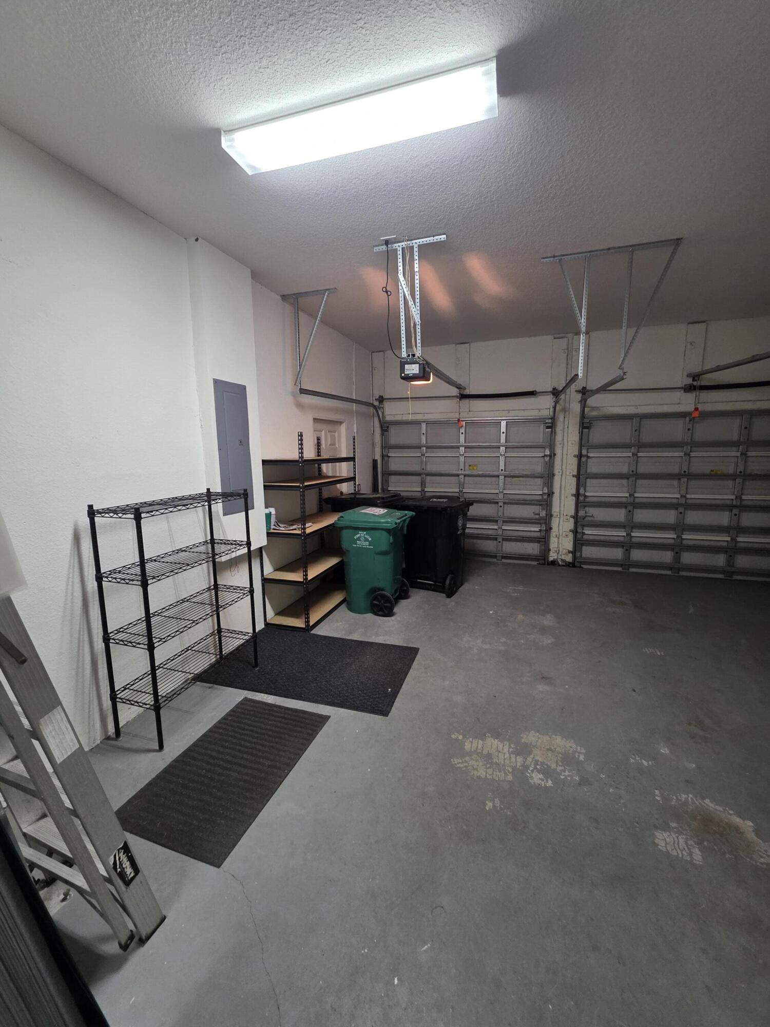 323 Northwest Sheffield Circle Port St. Lucie, FL 34983 - Photo 15 of 31 a view of a garage