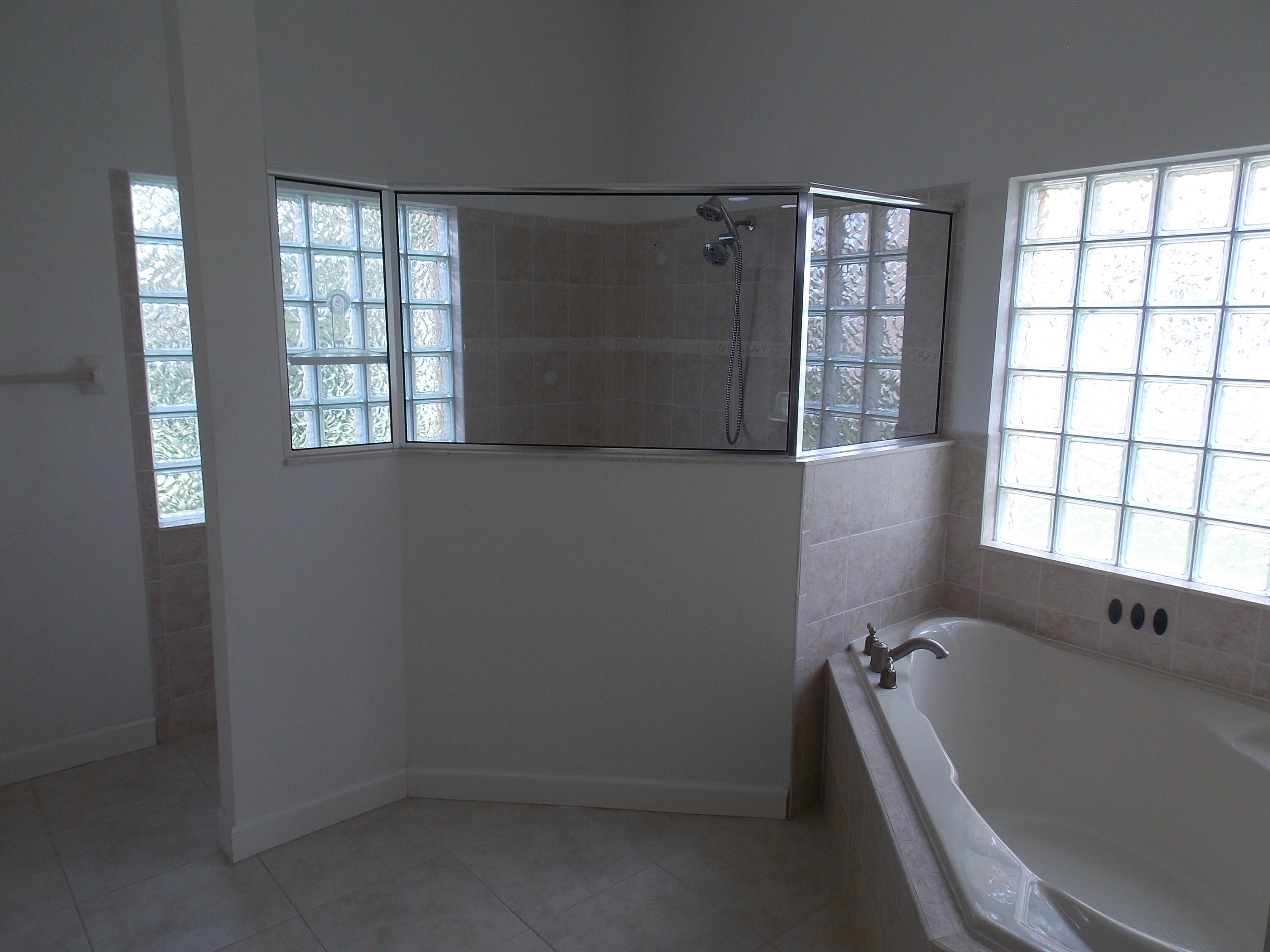 323 Northwest Sheffield Circle Port St. Lucie, FL 34983 - Photo 20 of 31 an empty room with windows