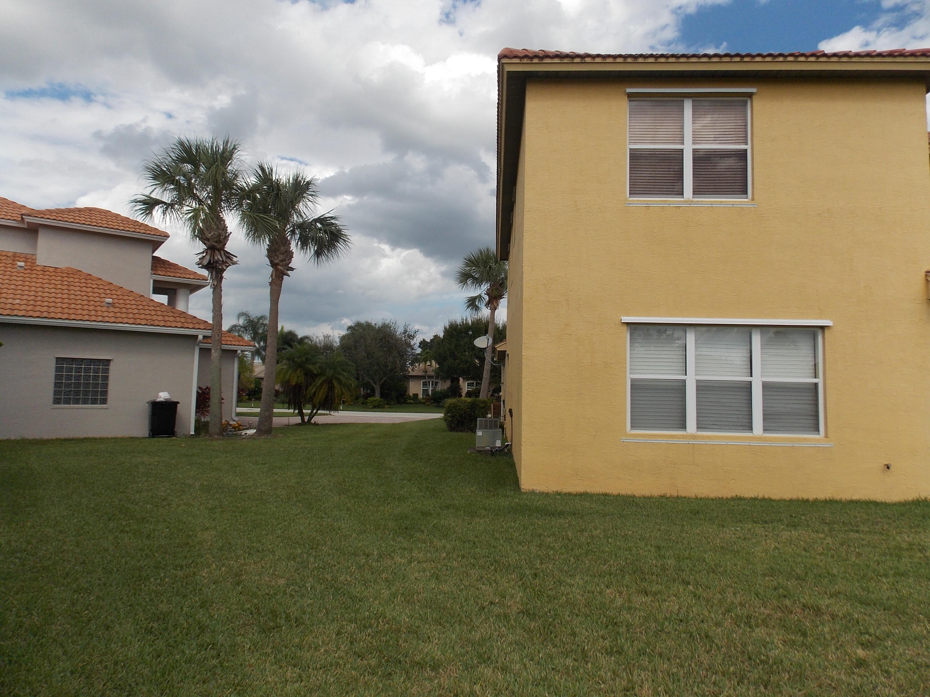 323 Northwest Sheffield Circle Port St. Lucie, FL 34983 - Photo 30 of 31 a house view with a garden space