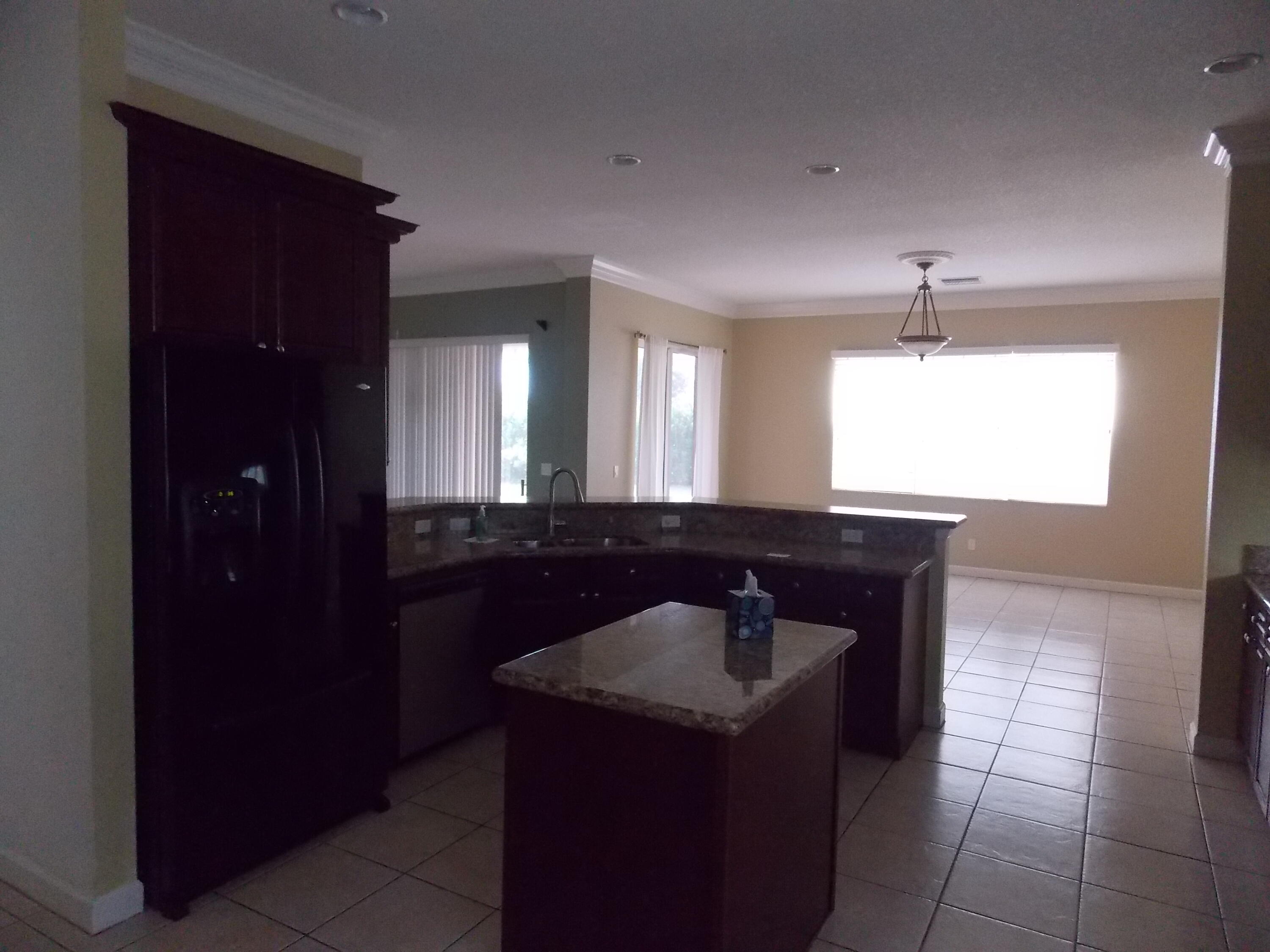 323 Northwest Sheffield Circle Port St. Lucie, FL 34983 - Photo 9 of 31 a bathroom with a sink and a mirror