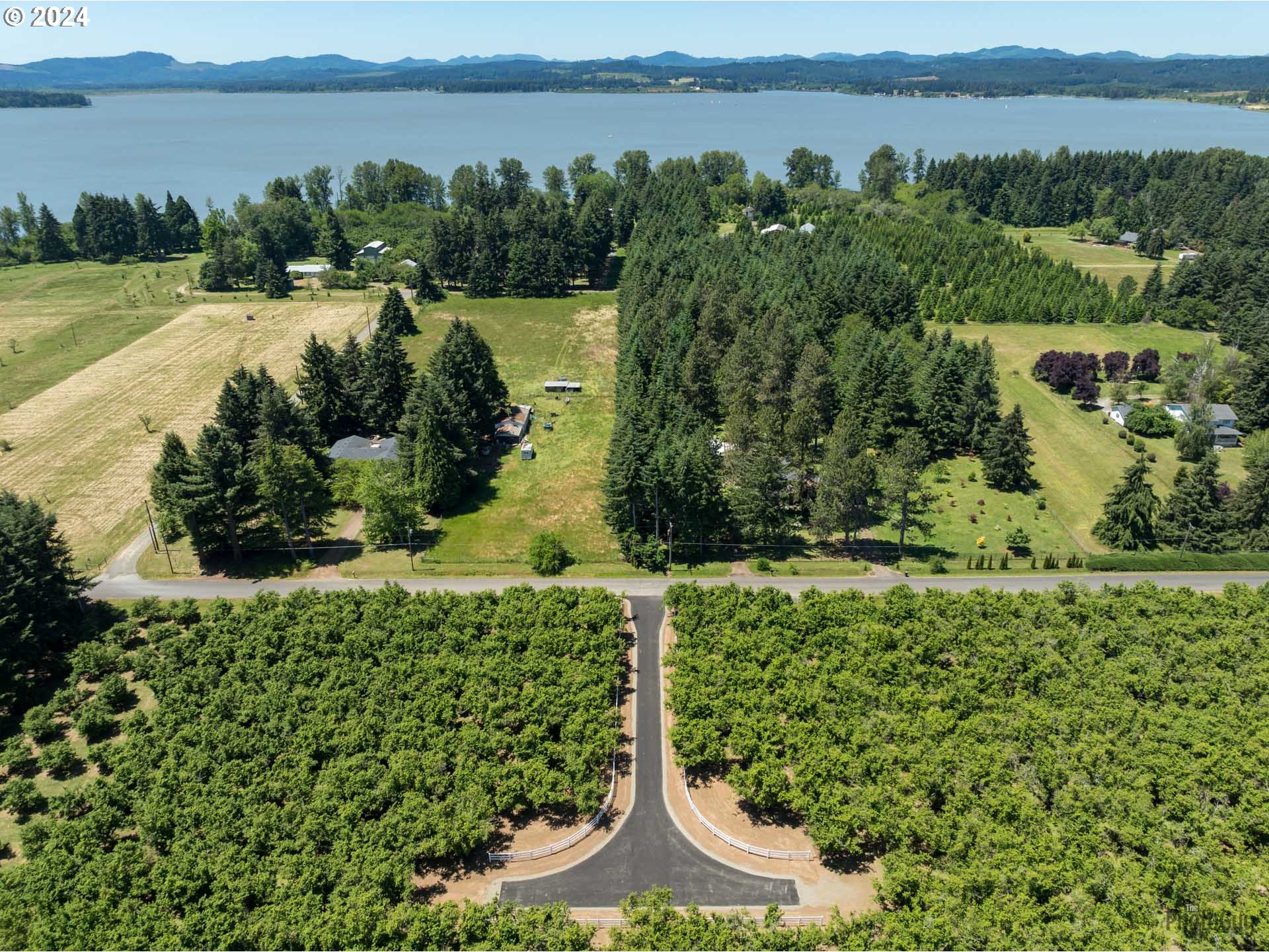 Shore Lane, Unit 1 Eugene, OR 97402 - Photo 14 of 16 a view of a lake with a building in the background