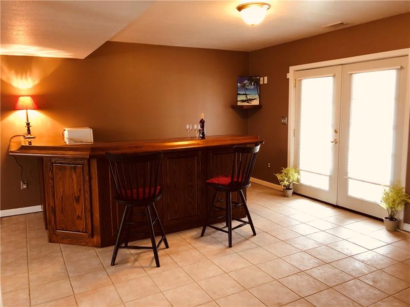 441 Whitestown Road Butler, PA 16001 - Photo 18 of 25 Beautiful hardwood bar with dry sink and beverage refrigerator. Room size 25 x 20. Walk out to the patio and back yard.