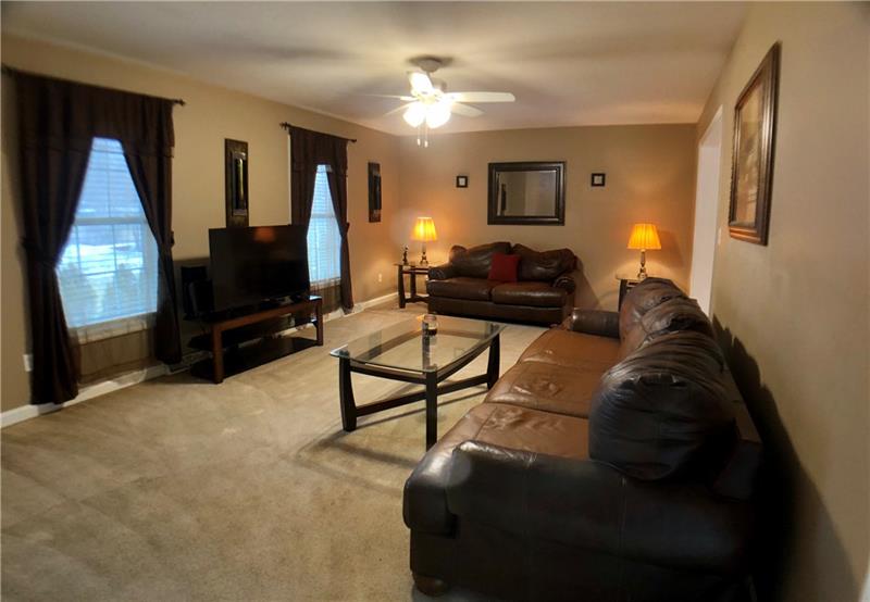 441 Whitestown Road Butler, PA 16001 - Photo 4 of 25 Generous living room with two bright windows, ceiling fan and is open to the dining room. Size 20 x 13