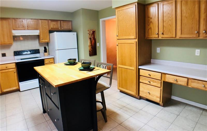 441 Whitestown Road Butler, PA 16001 - Photo 8 of 25 The island is a perfect place to sit or work in your new kitchen. Includes all appliances, island, pantry wall with built-in desk area. Ceramic tile flooring Size 15 x 13