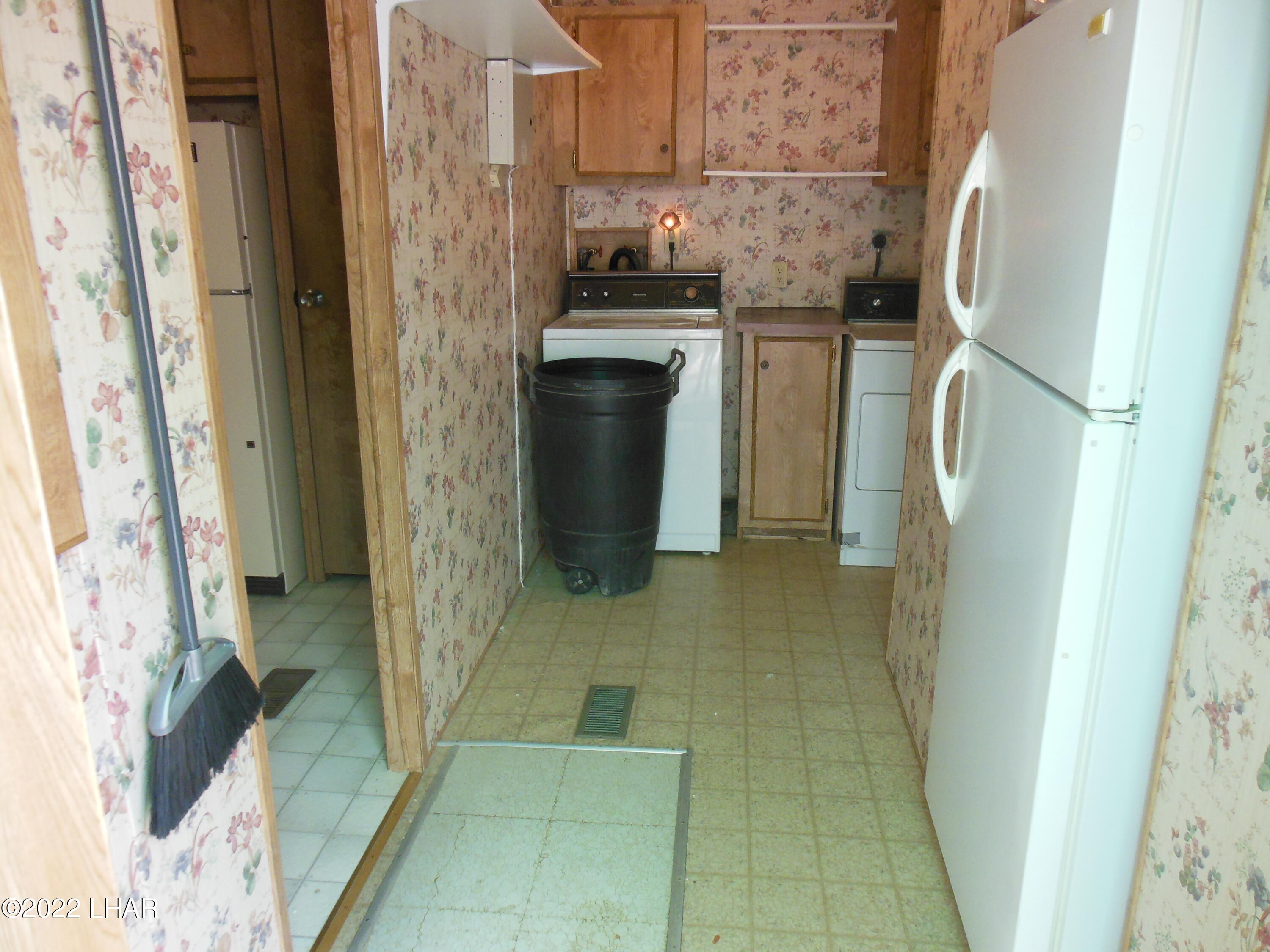 3744 North Bryce Road, Unit 54 Golden Valley, AZ 86413 - Photo 13 of 45 view of laundry from back door