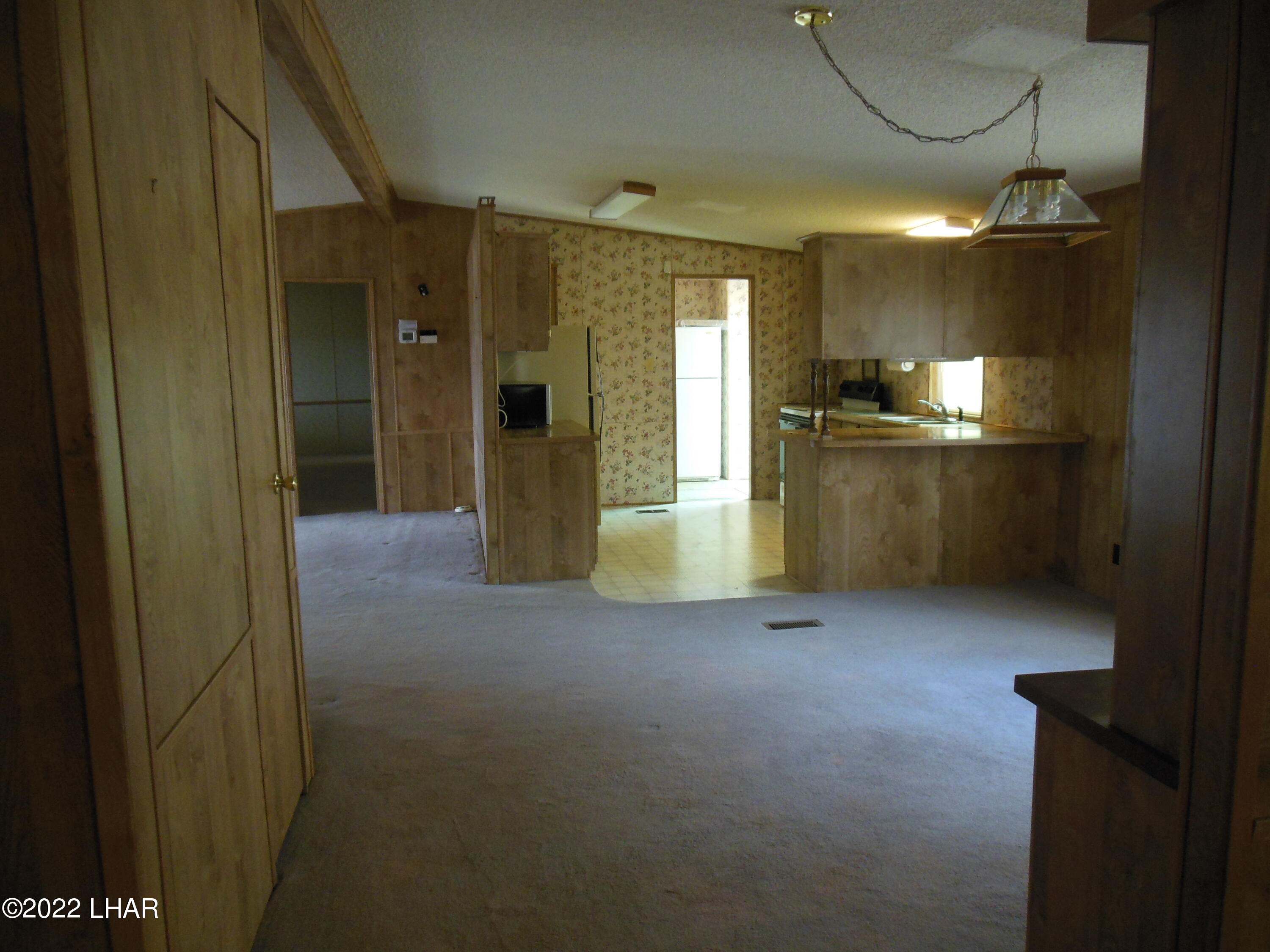 3744 North Bryce Road, Unit 54 Golden Valley, AZ 86413 - Photo 25 of 45 looking from 2nd living room towards kitchen