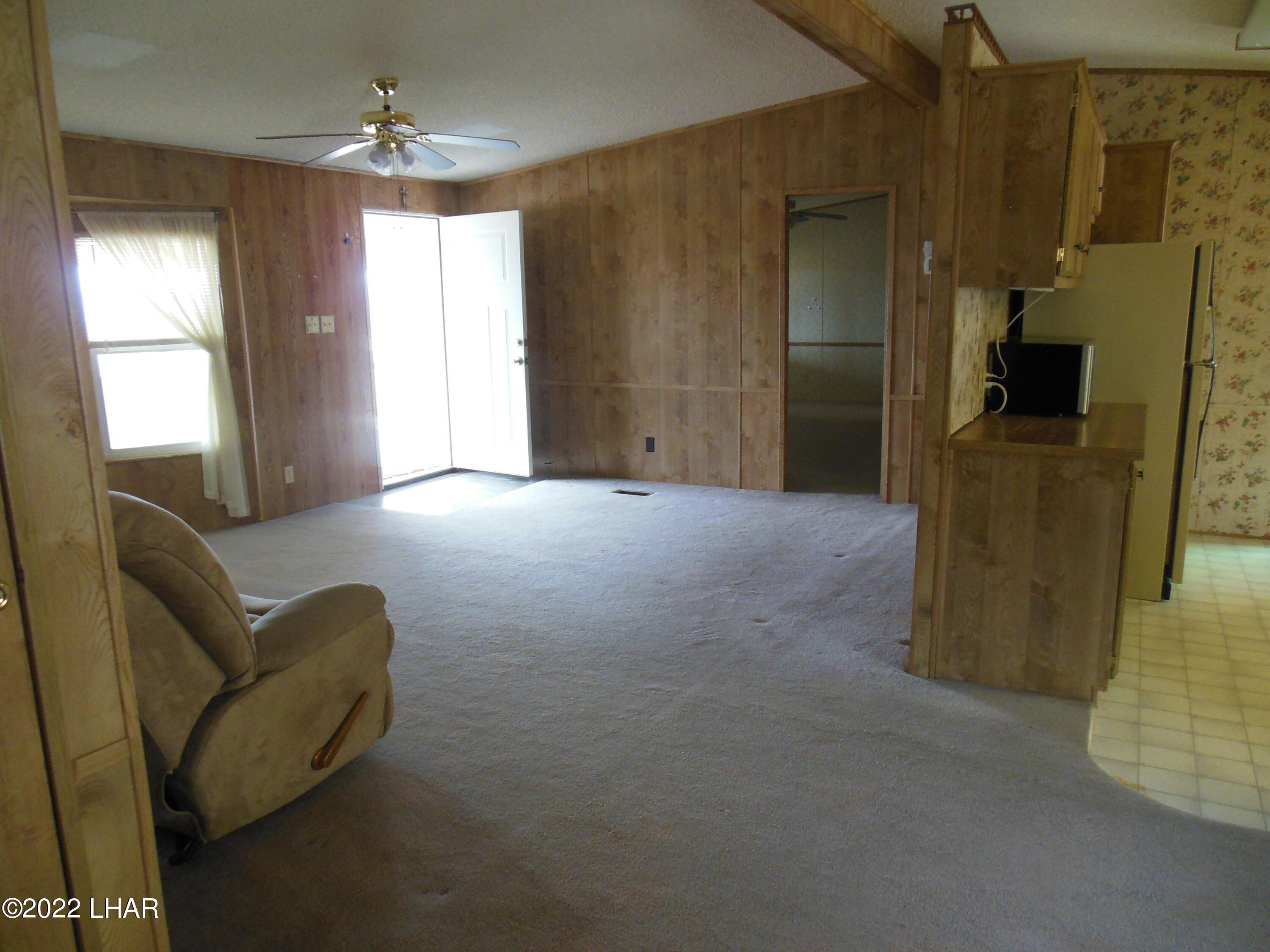 3744 North Bryce Road, Unit 54 Golden Valley, AZ 86413 - Photo 26 of 45 Views into the main living room