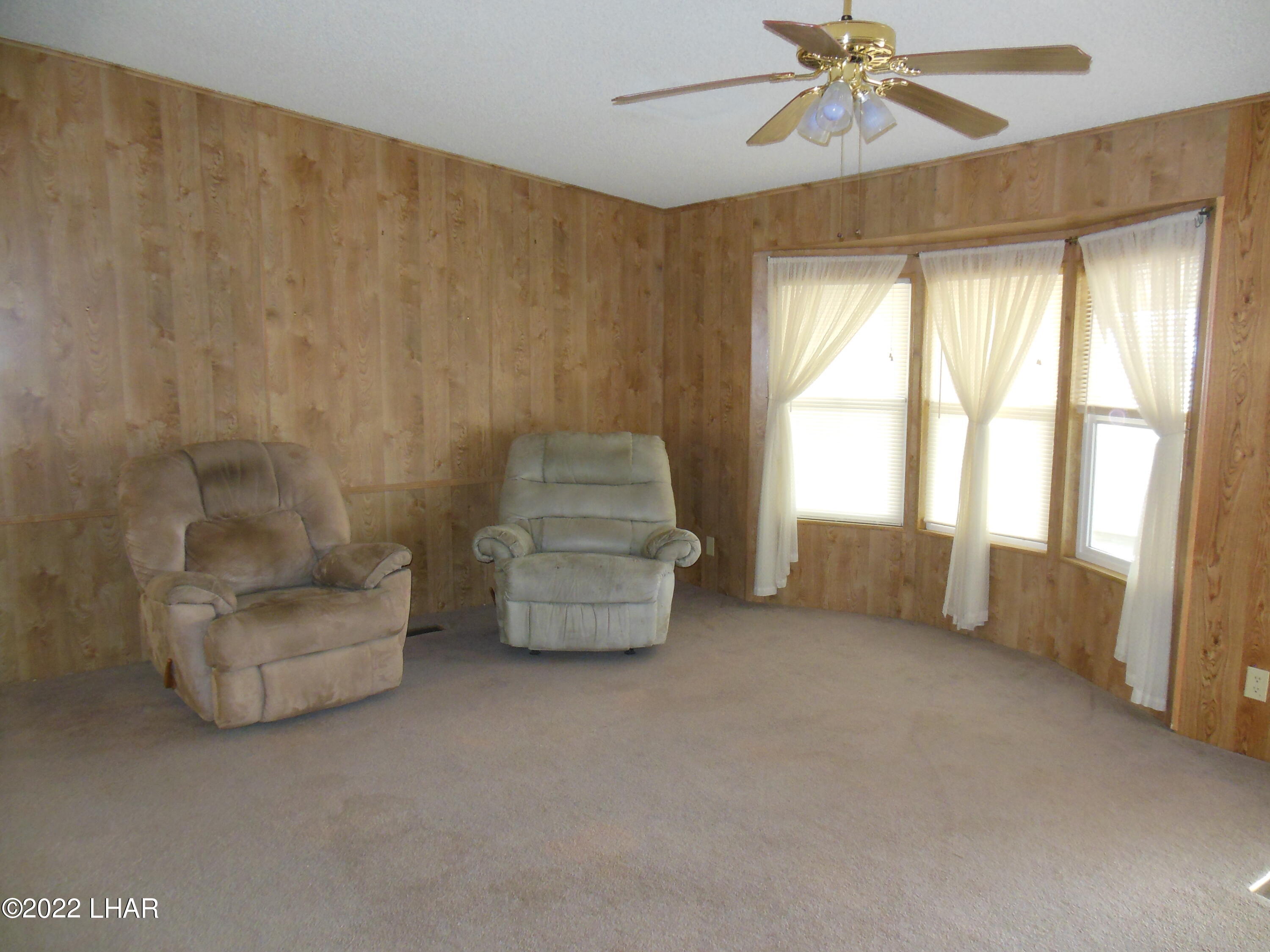 3744 North Bryce Road, Unit 54 Golden Valley, AZ 86413 - Photo 27 of 45 Main living room, chairs have been removed