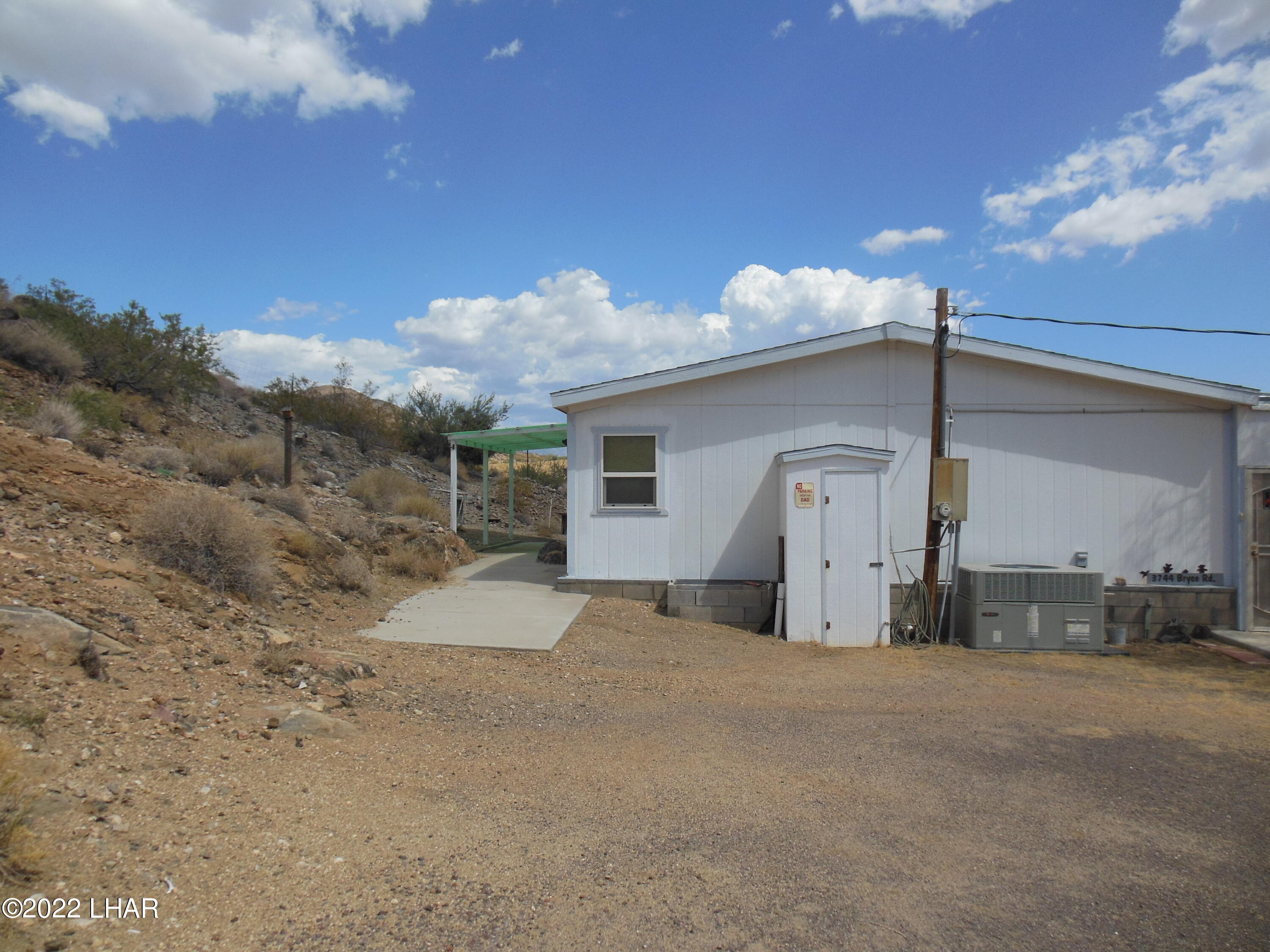 3744 North Bryce Road, Unit 54 Golden Valley, AZ 86413 - Photo 3 of 45 North side of house