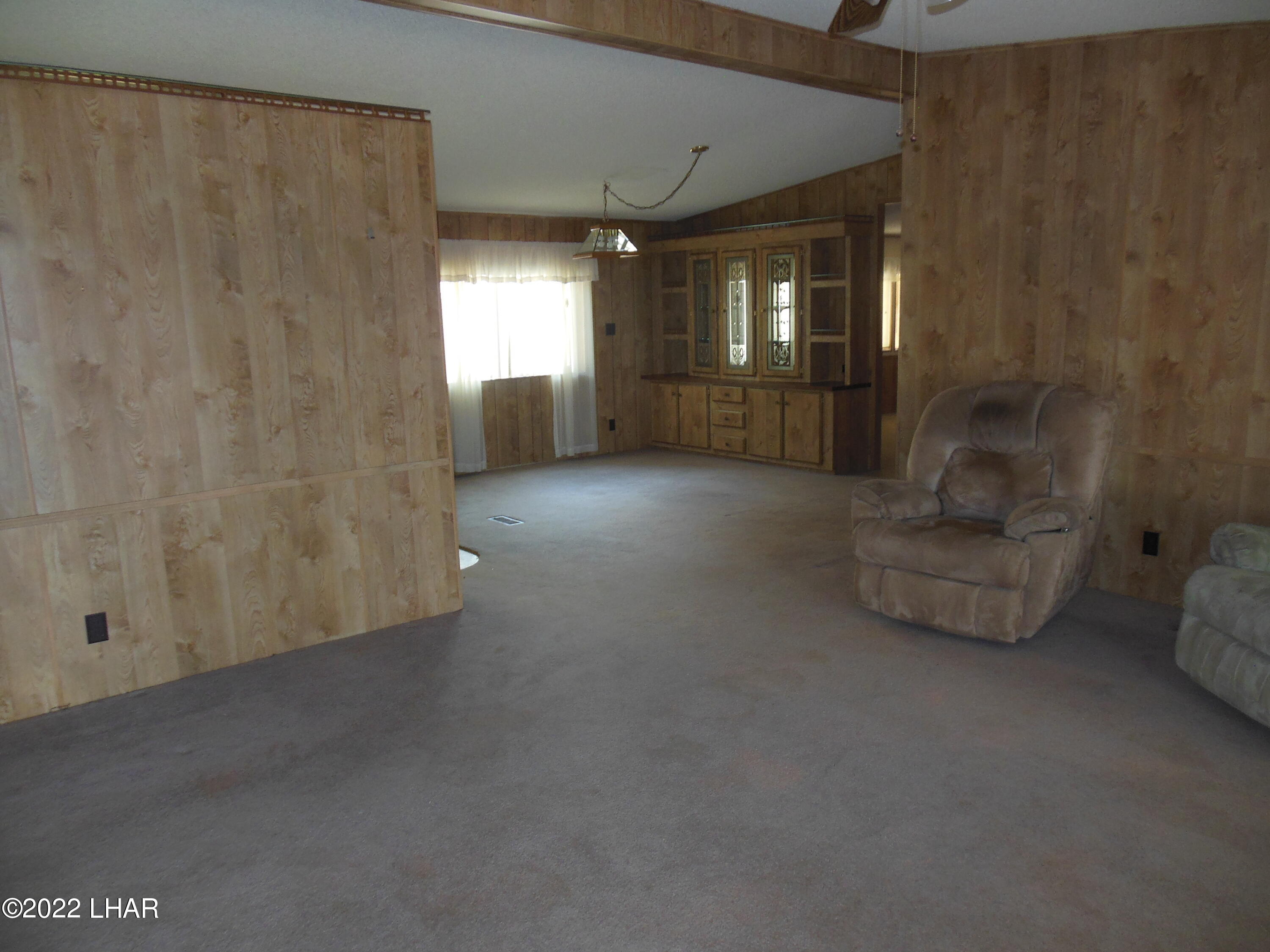 3744 North Bryce Road, Unit 54 Golden Valley, AZ 86413 - Photo 35 of 45 looking from front door across main living room to dining room area