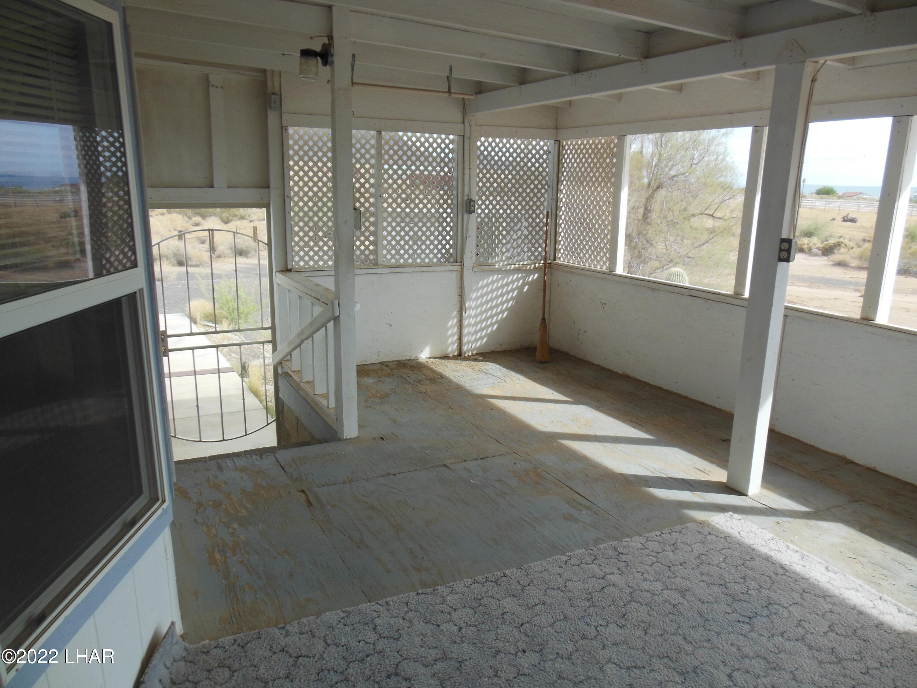 3744 North Bryce Road, Unit 54 Golden Valley, AZ 86413 - Photo 36 of 45 Front porch looking south from front door