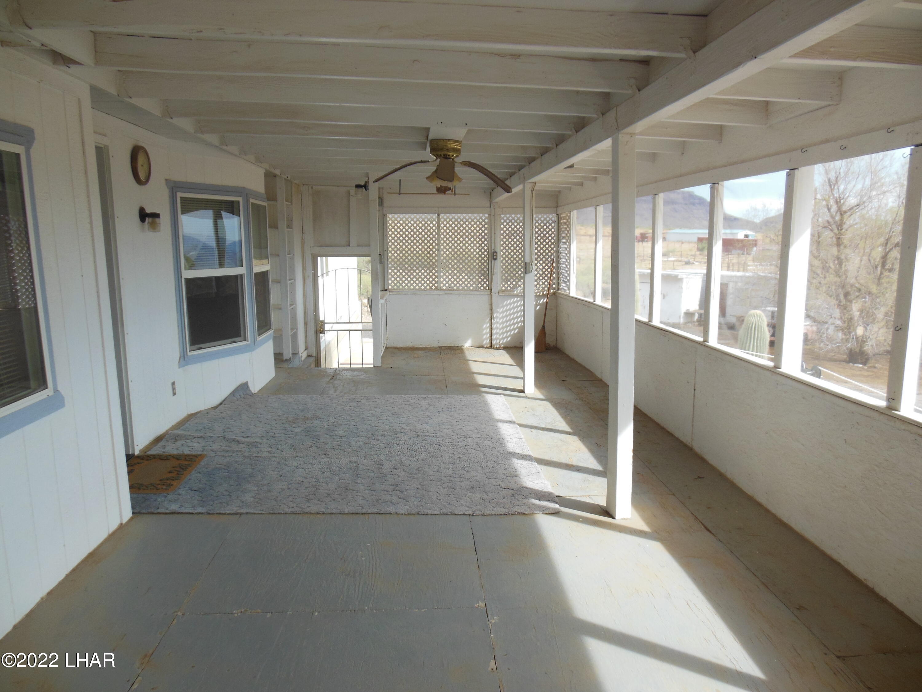 3744 North Bryce Road, Unit 54 Golden Valley, AZ 86413 - Photo 38 of 45 Front screened in porch looking from north to south access