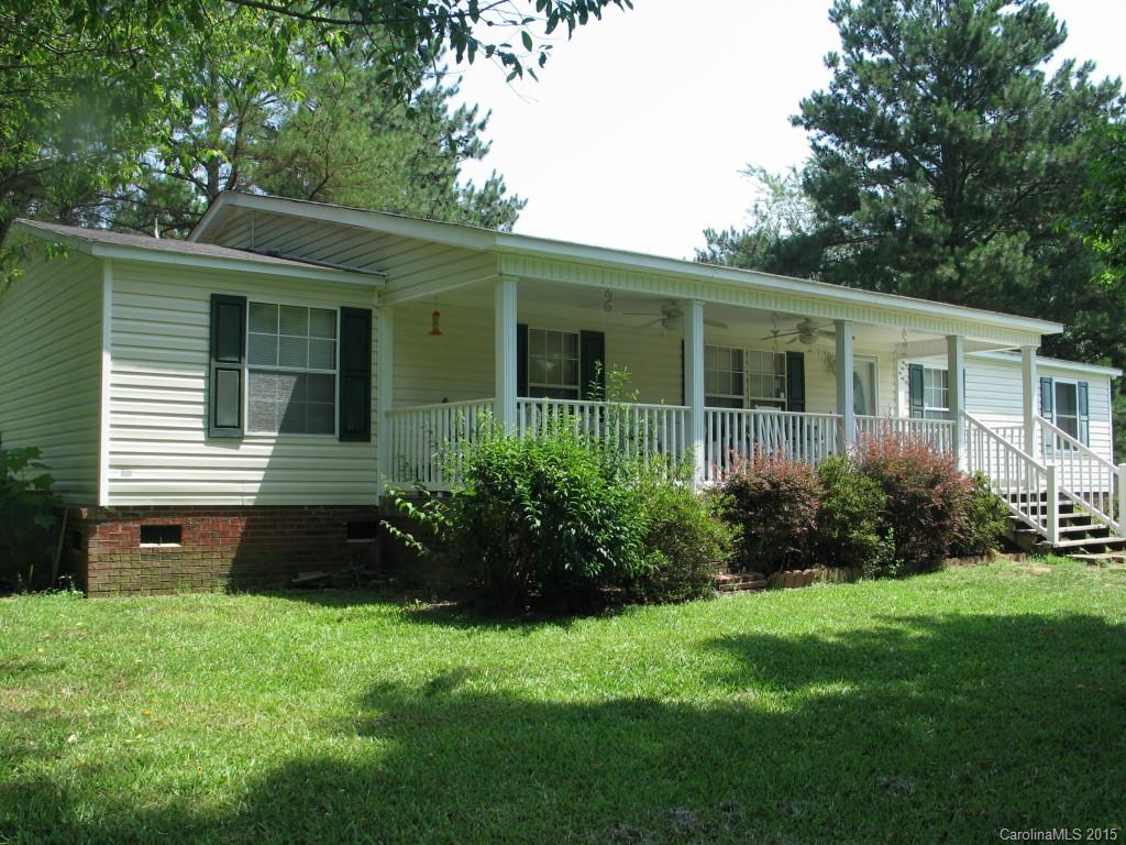 1935 Chestnut Lane Edgemoor, SC 29712 - Photo 1 of 8 a front view of a house with a garden
