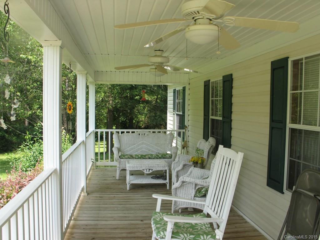 1935 Chestnut Lane Edgemoor, SC 29712 - Photo 5 of 8 a view of a chairs and table in patio with a fireplace