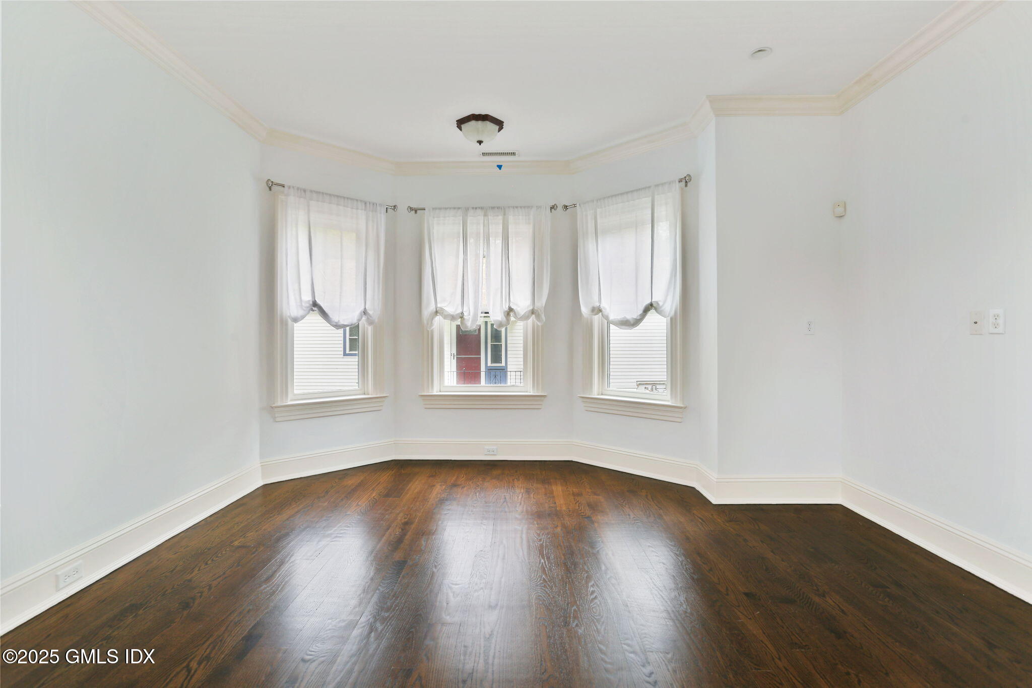 11 Harding Road Old Greenwich, CT 06870 - Photo 11 of 31 a view of wooden floor and windows in a room