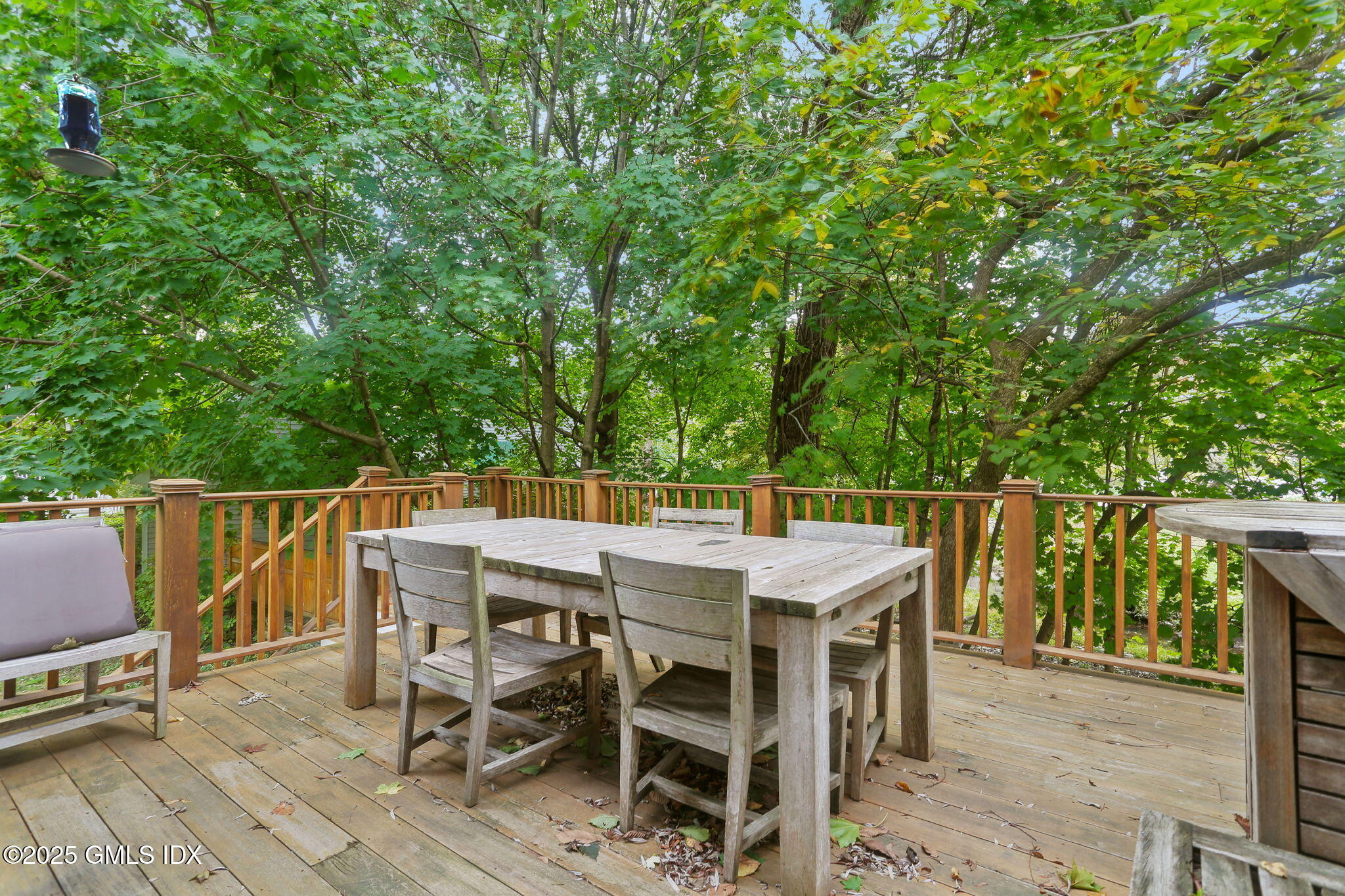 11 Harding Road Old Greenwich, CT 06870 - Photo 15 of 31 a dinning table and chairs in a patio