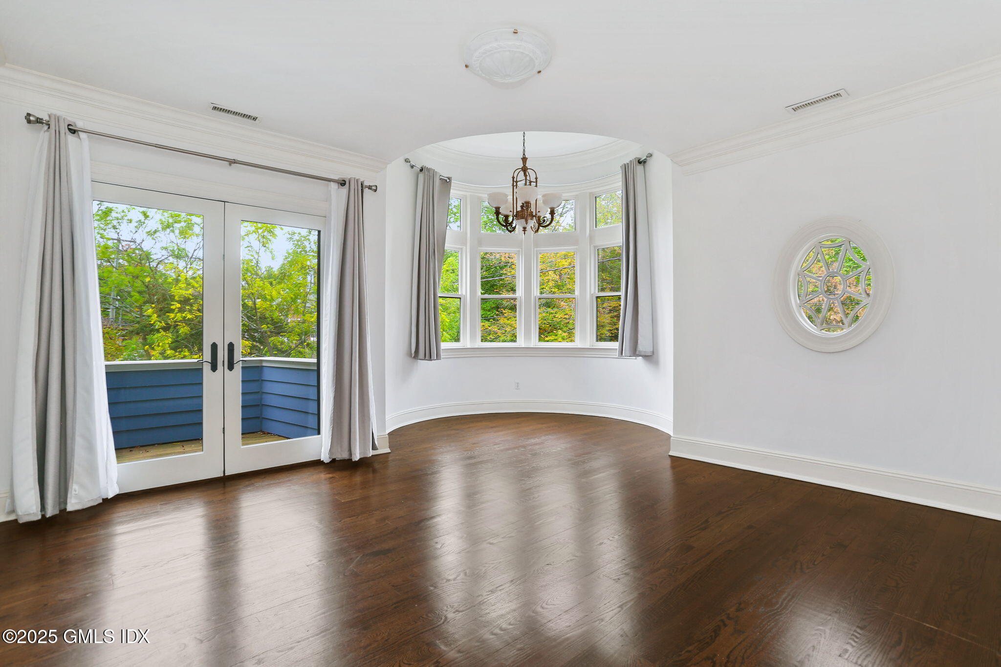 11 Harding Road Old Greenwich, CT 06870 - Photo 18 of 31 an empty room with wooden floor fan and windows