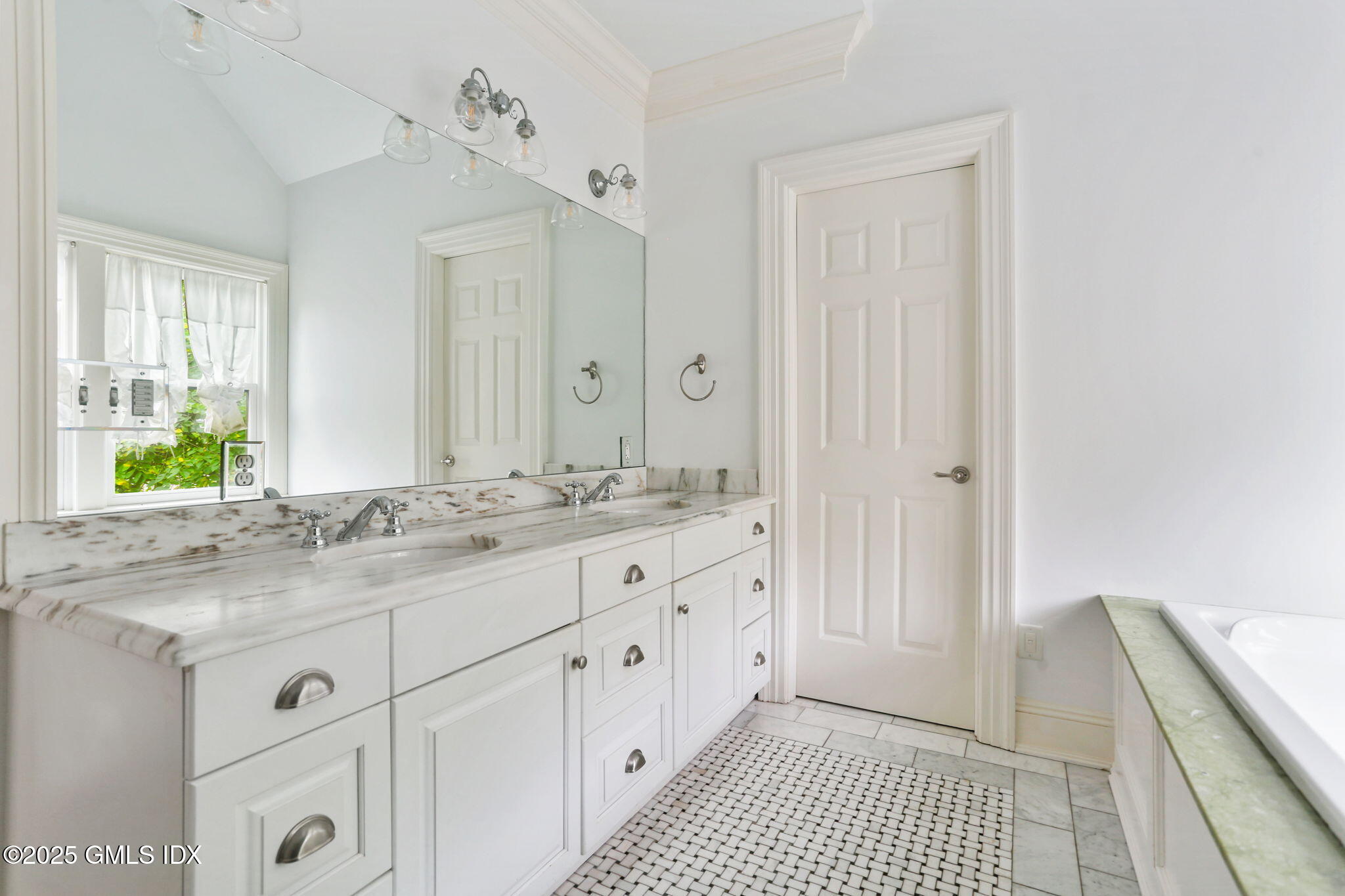 11 Harding Road Old Greenwich, CT 06870 - Photo 20 of 31 a bathroom with a granite countertop sink and a mirror