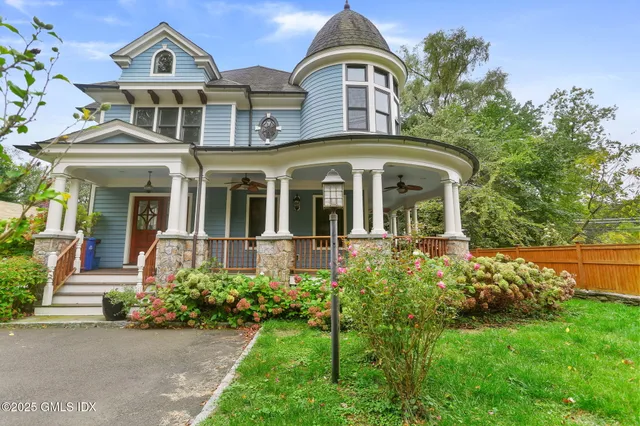 front view of a house with a garden
