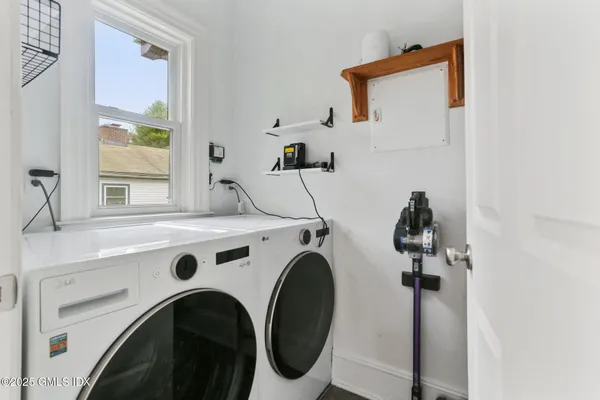 a utility room with dryer and washer