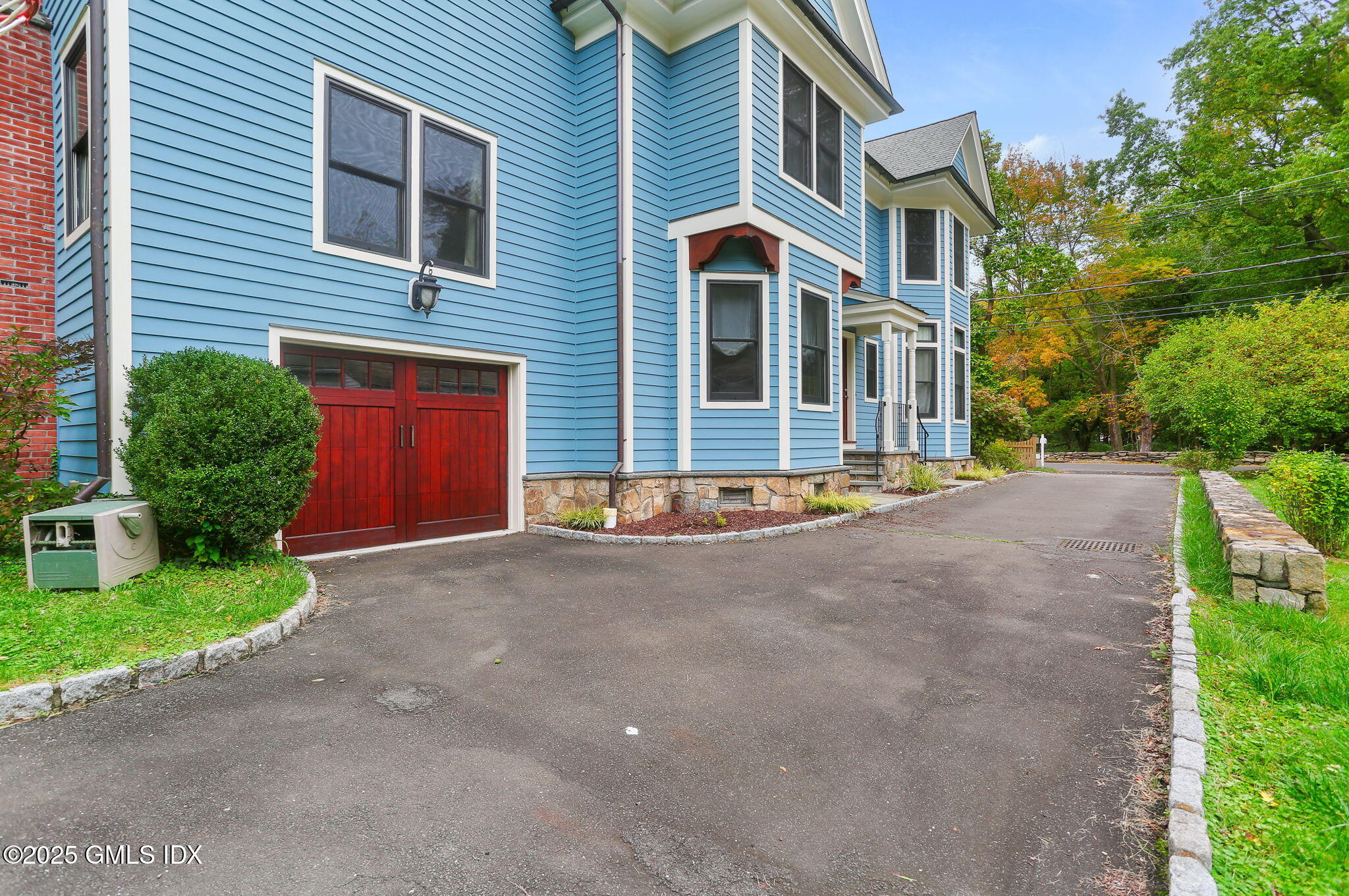 11 Harding Road Old Greenwich, CT 06870 - Photo 4 of 31 a front view of a house with a yard and garage