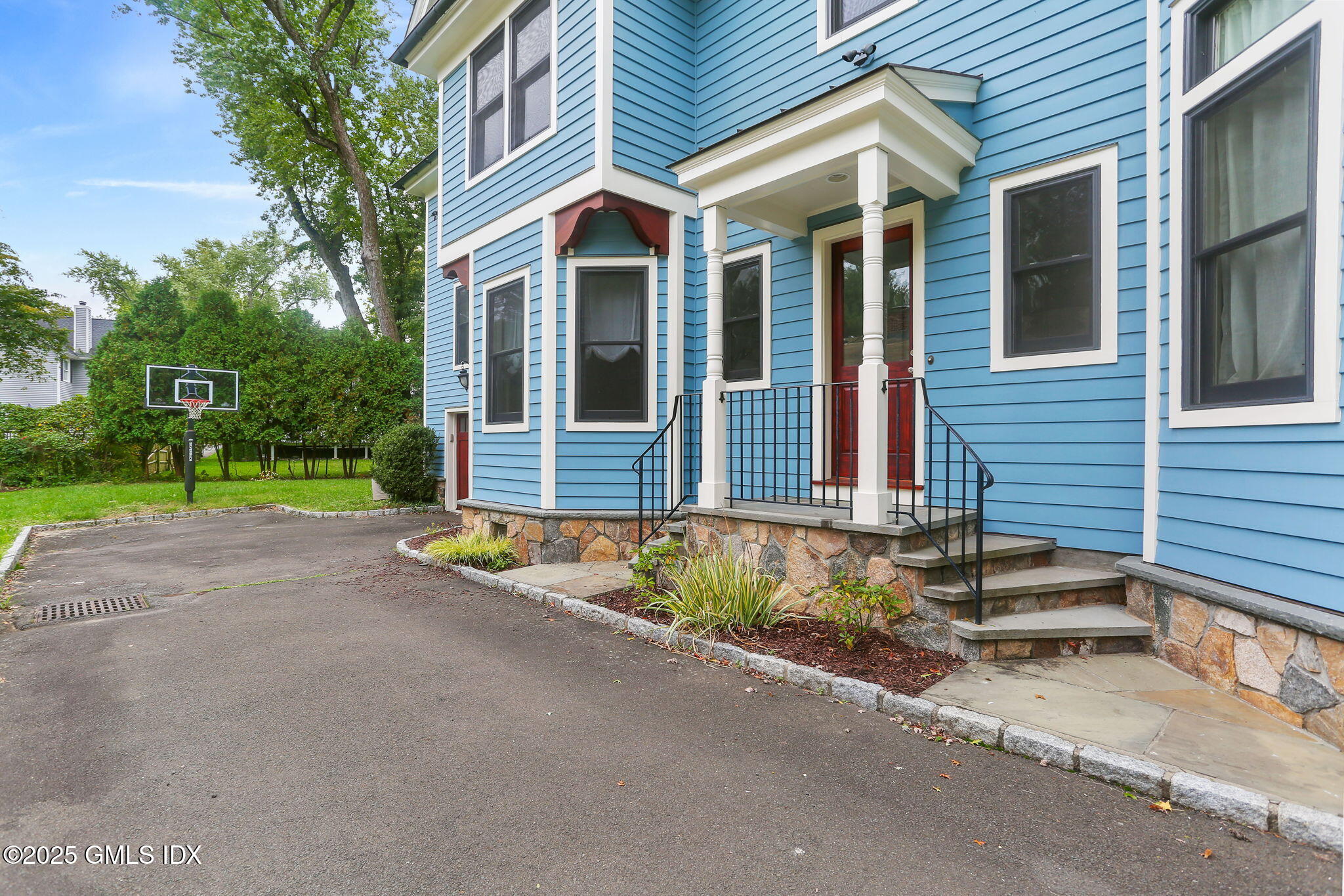 11 Harding Road Old Greenwich, CT 06870 - Photo 5 of 31 a view of brick house with a yard and large tree