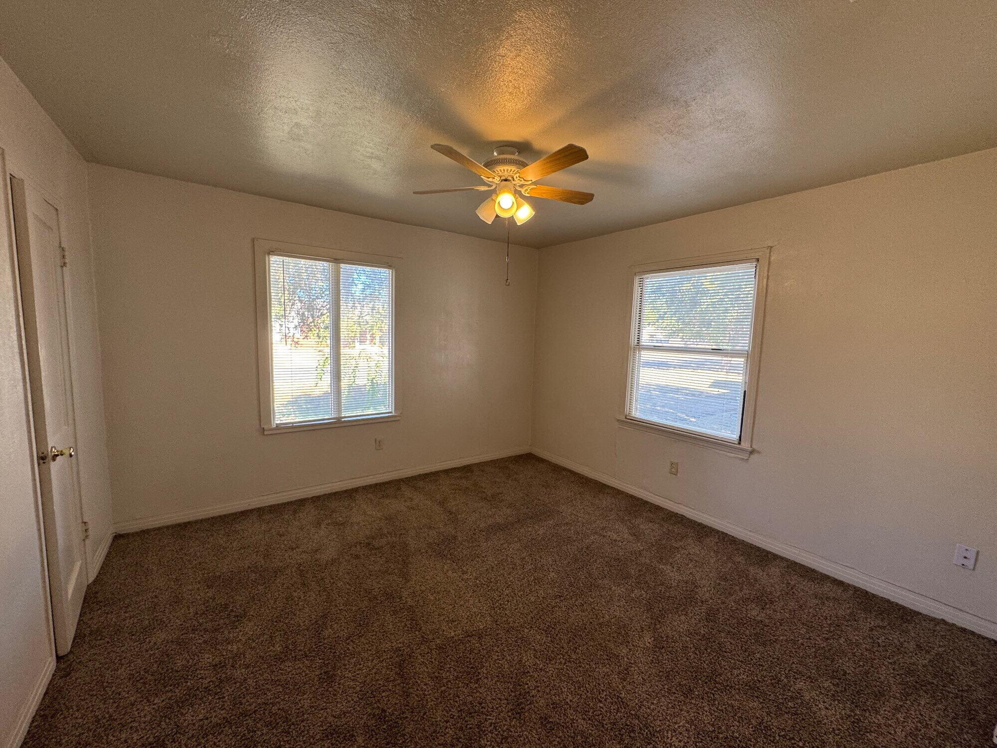 2119 32nd Street Lubbock, TX 79411 - Photo 6 of 9 a view of an empty room with a window