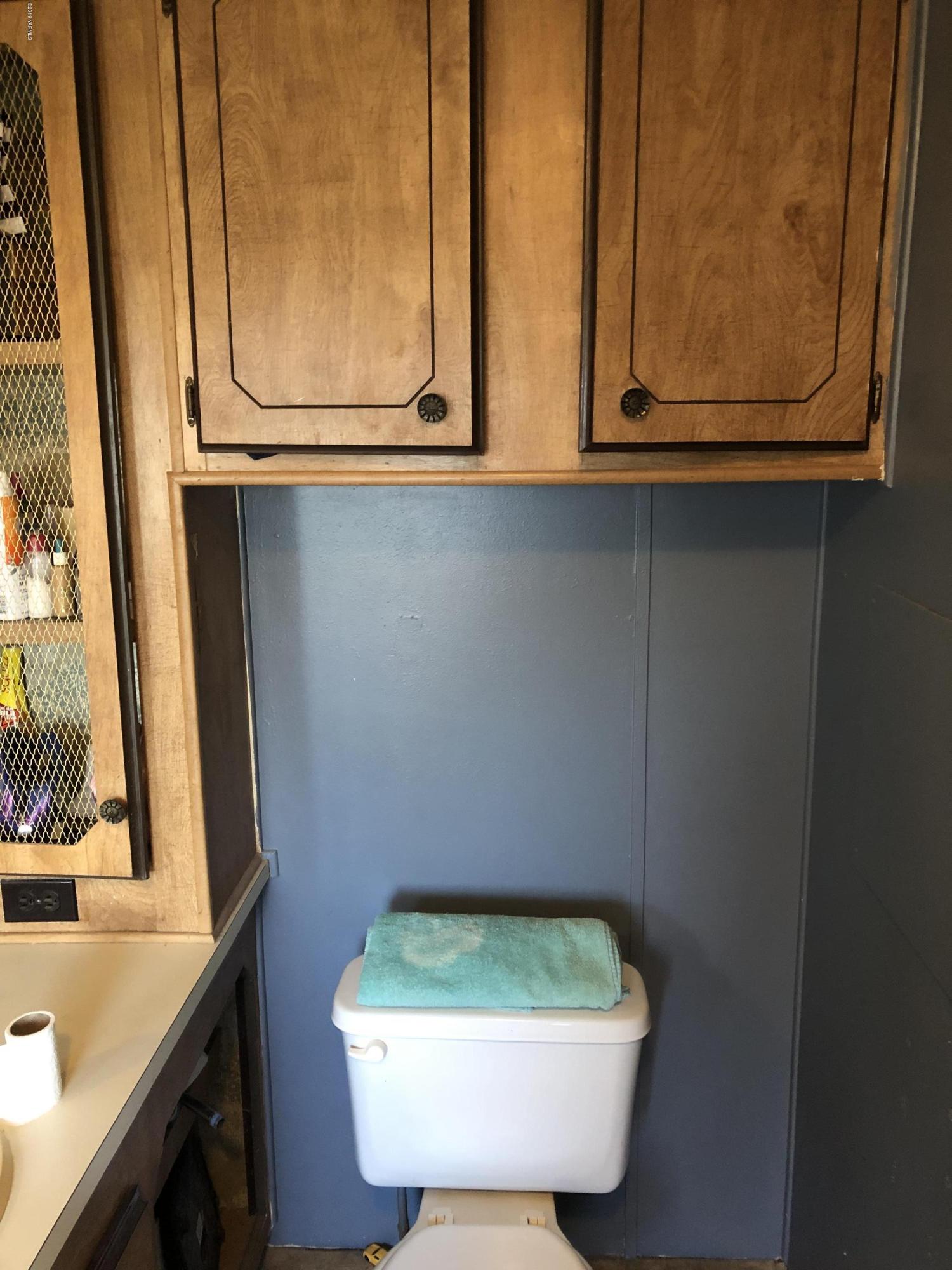 7101 Bell Road Yakima, WA 98901 - Photo 11 of 20 a bathroom with a sink and a mirror